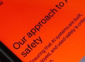 Close-up of a phone screen displaying text about AI safety on an orange background.