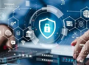 Digital tablet displaying cybersecurity shield with various tech icons.