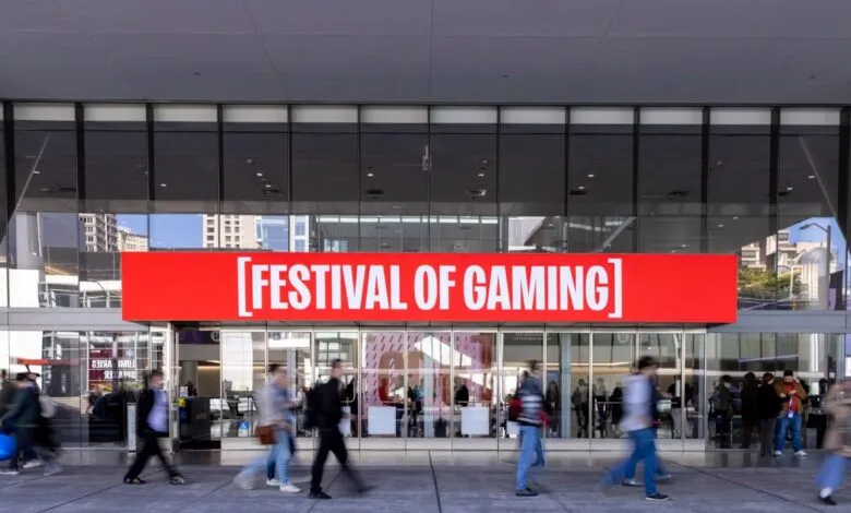 Festival of Gaming entrance with blurred people walking by.