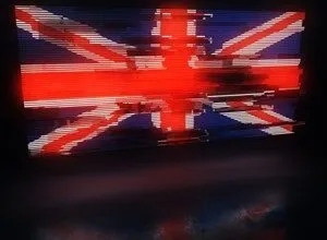 Distorted Union Jack flag with glitch effect, red, white, and blue.