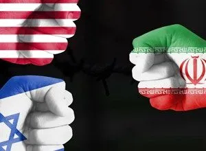 Three fists painted with USA, Israel, and Iran flags facing each other over barbed wire.