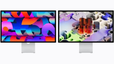 Two Apple Studio Displays showing colorful abstract wallpapers.