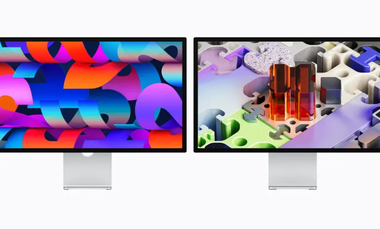 Two Apple Studio Displays showing colorful abstract wallpapers.