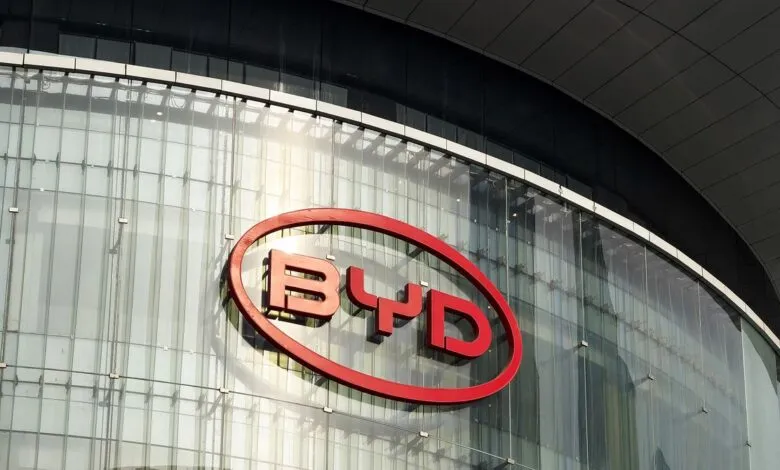 BYD logo on a modern glass building facade.