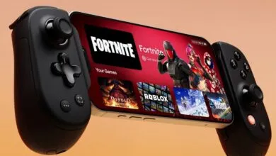 Backbone One mobile gaming controller attached to iPhone, displaying game options.