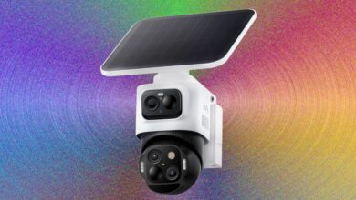 Eufy security camera with solar panel against a colorful background.