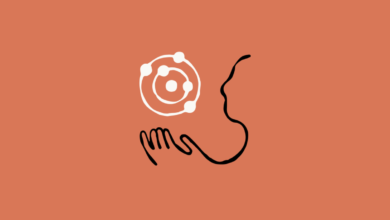 Abstract illustration of hand holding atom near a face profile.