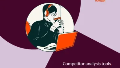 Person with headphones using laptop and drinking coffee.