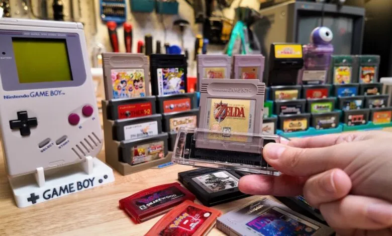 Original Game Boy with Zelda cartridge and game collection.