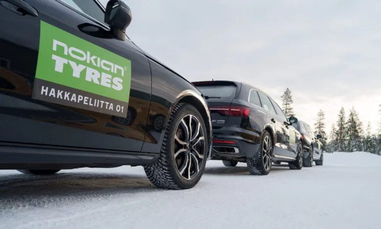 Cars with Nokian Tyres Hakka winter tires parked on snow.