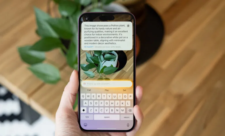 Hand holding phone displaying ChatGPT description of a Pothos plant.