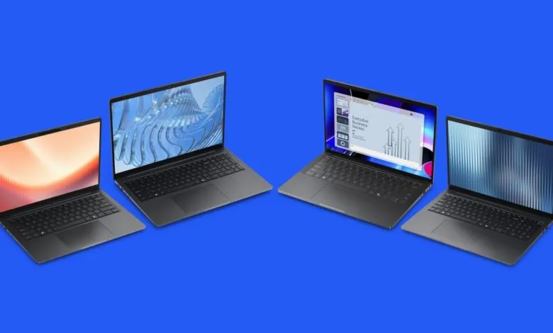 Four open Dell laptops with different screen displays on a blue background.