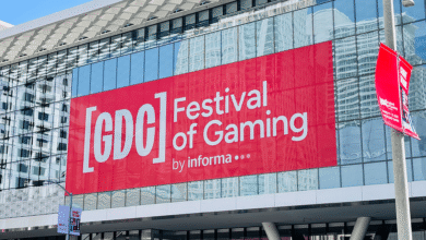 Large GDC Festival of Gaming banner on glass building facade.