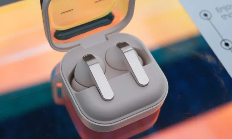 Close-up of open wireless earbuds case with earbuds inside.