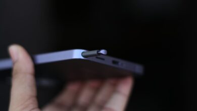 Close-up of a phone with an S Pen stylus being inserted.