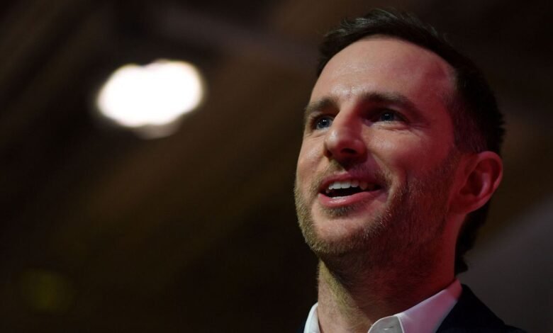 Joe Gebbia, Airbnb co-founder, looks up with a slight smile.