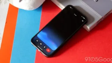Smartphone displaying a 'Live' interface on a colorful background.