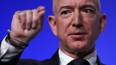 Close-up of Jeff Bezos speaking with a raised fist.