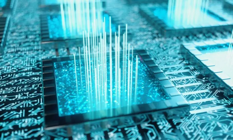 Close-up of a computer chip with glowing blue light and circuit patterns.