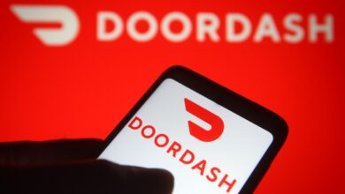 DoorDash app displayed on a smartphone screen against a red background.