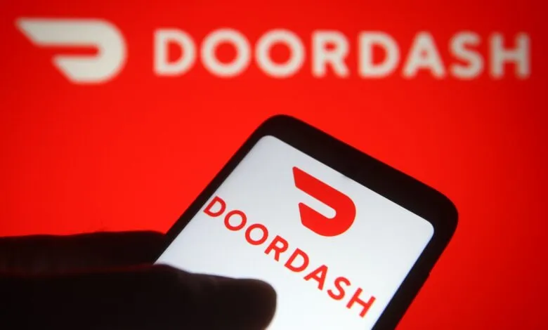 DoorDash app displayed on a smartphone screen against a red background.