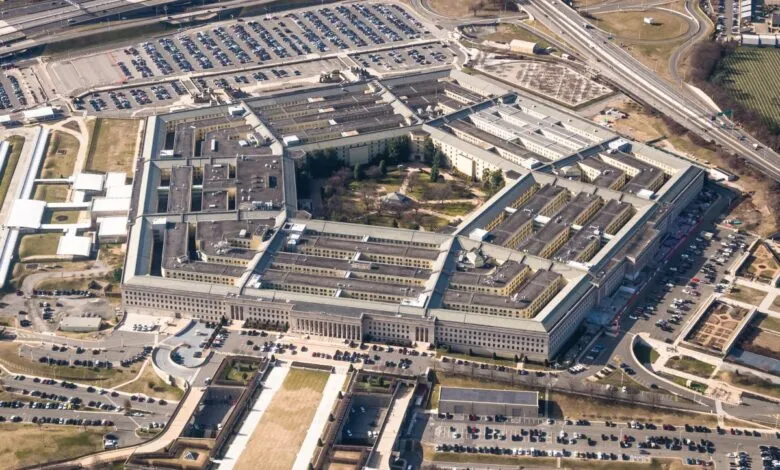Aerial view of the Pentagon building and surrounding parking lots and highways.