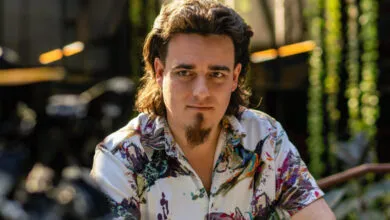 Palmer Luckey, Anduril founder, poses in colorful shirt.