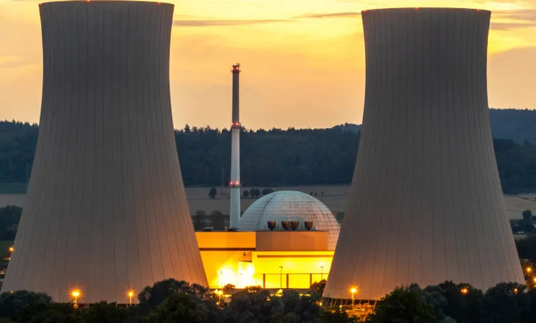 Grohnde nuclear plant with two cooling towers at dusk.