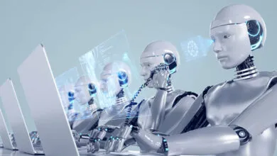 Robots working in an office, using laptops and phones, with digital interfaces.