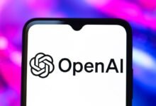 Close-up of a smartphone displaying the OpenAI logo.