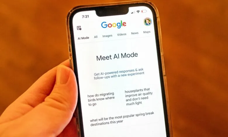 Close-up of a smartphone displaying Google's AI Mode interface.