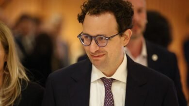 Nathaniel Gleicher at an event, wearing glasses and a suit.