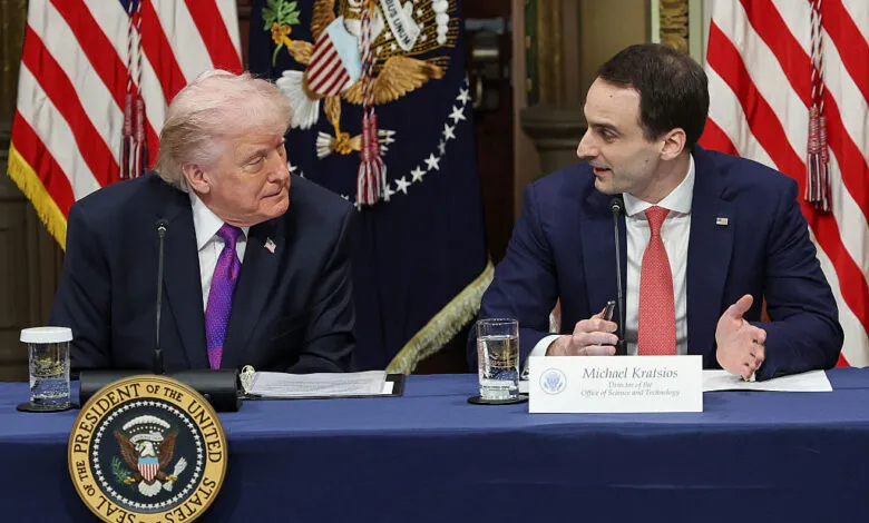 Donald Trump and Michael Kratsios at White House roundtable, flags behind.
