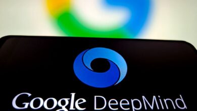 Smartphone displaying the Google DeepMind logo against a blurred Google background.