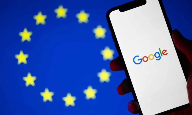 Google logo displayed on a phone screen with the EU flag in the background.
