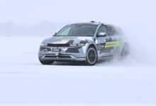 Elaphe electric car driving on snow-covered surface.