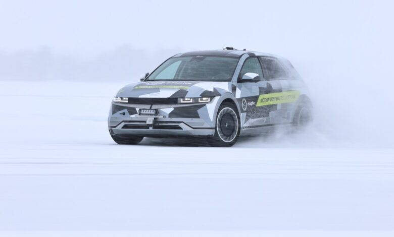 Elaphe electric car driving on snow-covered surface.