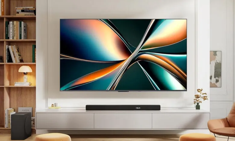 Modern living room with large TV displaying abstract art.