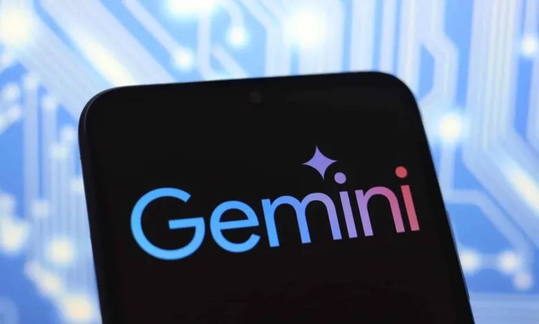 Google Gemini logo on a smartphone screen against a blue circuit board background.
