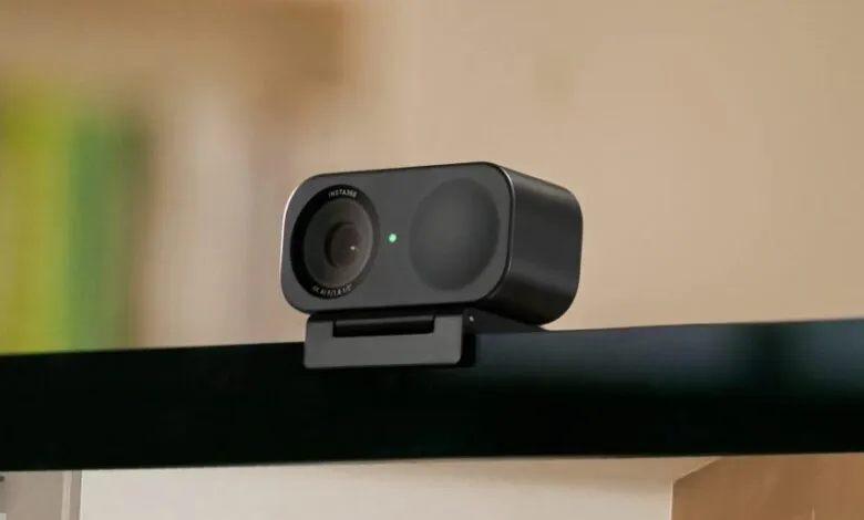Insta360 Link webcam mounted on a monitor, ready for video conferencing.