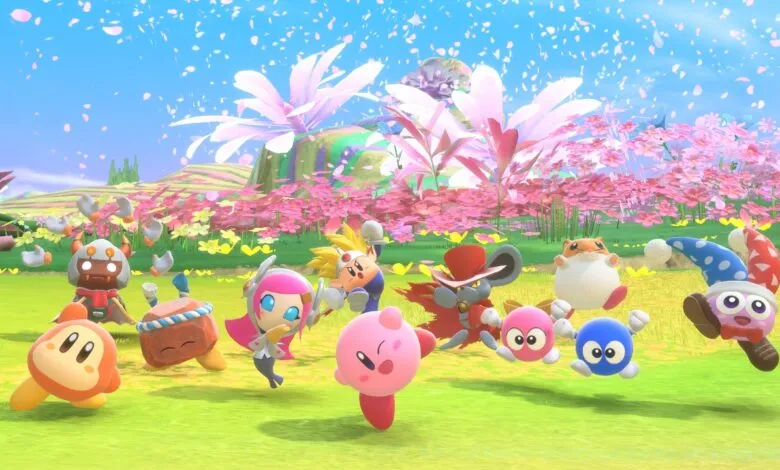 Group of Kirby characters in a vibrant, colorful outdoor setting with falling flower petals.