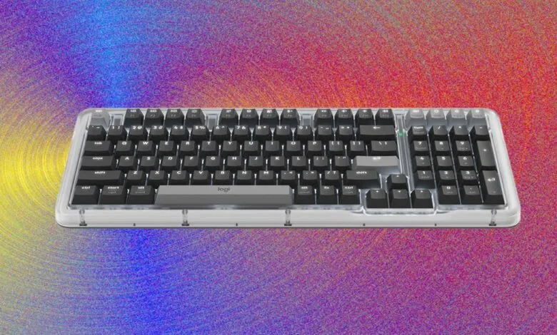 Logitech K98M mechanical keyboard with clear frame and dark keycaps.
