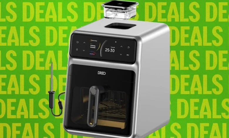 Dreo air fryer with temperature probe and water reservoir on green 'deals' background.
