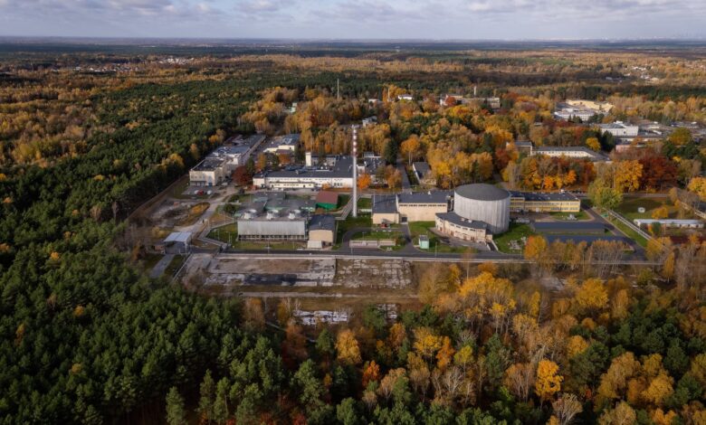 Aerial view of research facility surrounded by autumn trees.