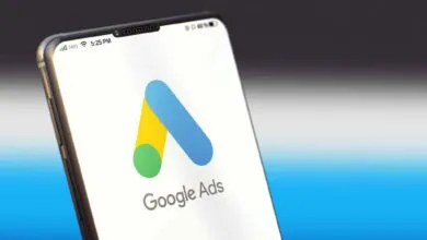 Smartphone displaying the Google Ads logo on a white screen.