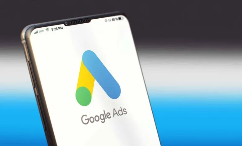 Smartphone displaying the Google Ads logo on a white screen.