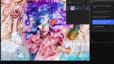 Person with colorful hair and heart sunglasses lies on a beach-themed backdrop.