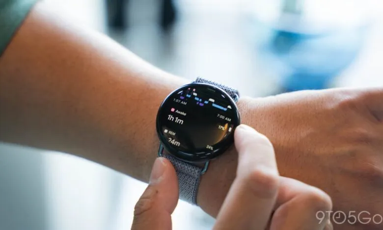Close-up of a smartwatch displaying sleep data on a wrist.