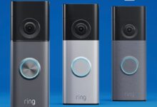 Three Ring video doorbells in different colors against a blue background.