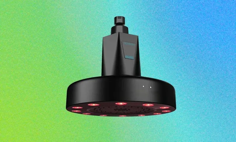 Black HigherDose red light showerhead with filter on colorful background.